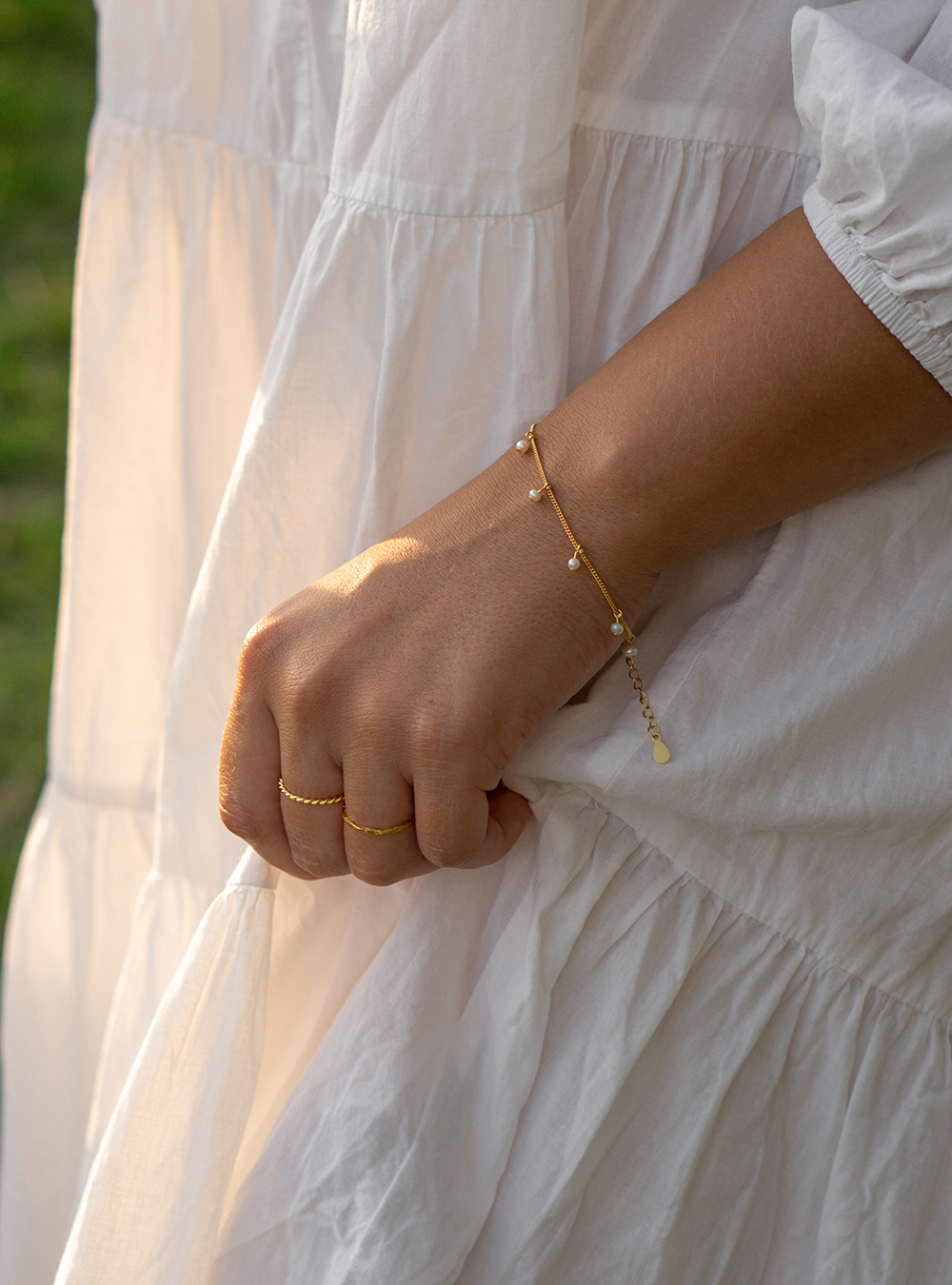 Guld armbånd med perler